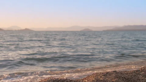 Evening on the beach, 4k real time movie, sunset in the Mediterranean bay Stock Footage 220353922