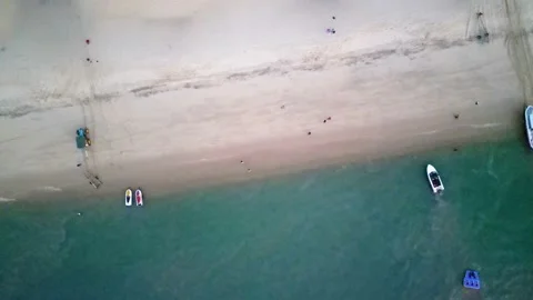 Evening beach from birds eye view, 4K Video stock 230593288