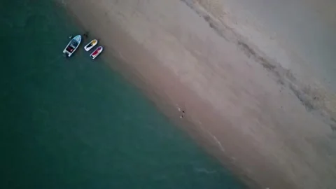 Evening beach from birds eye view, 4K Video stock 230595836
