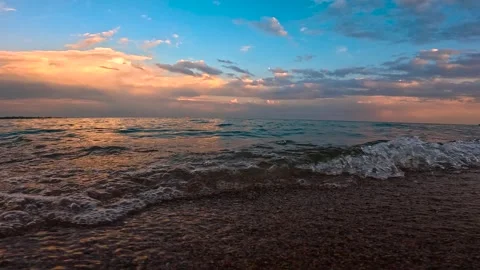 Evening beach on the lake in slow motion 動画素材 282357124
