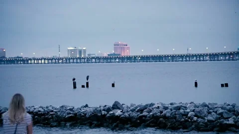 Evening Beach line with a bridge view in Ocean Springs. ms Stock Footage 166980073