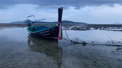 Evening beach at low tide with lots of boats. Stock Footage 231200599