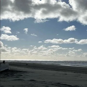An Evening at the beach nature sky clouds water and sand Stock Photos
