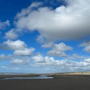 An Evening at the beach nature sky clouds water and sand again Stock Photos