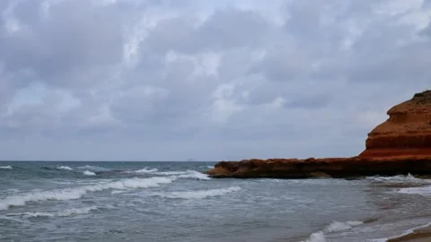 Evening on the beach in Spain. The clouds fly fast with timelapse. Stock Footage 138208707