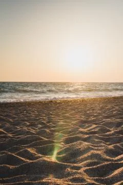 Evening beach at sunset in summer Stock Photos