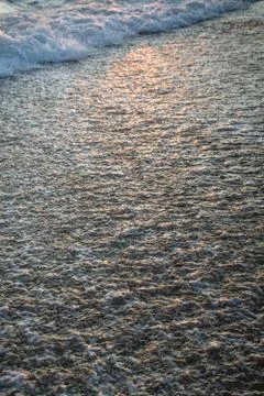 Evening beach at sunset in summer Stock Photos
