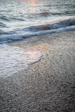 Evening beach at sunset in summer Stock Photos