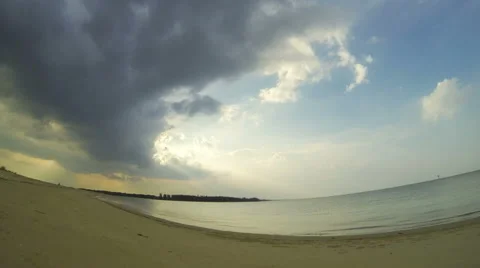 Evening beach time lapse, with storm clouds travelling through the sky. 4K Stock Footage 42986996
