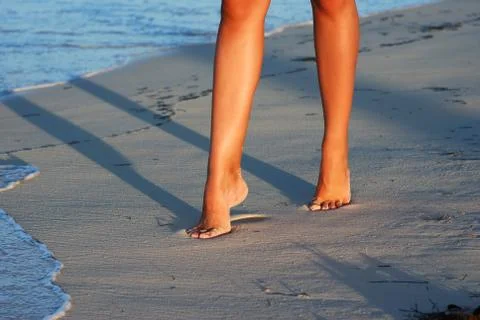 Evening beach walk Stock Photos