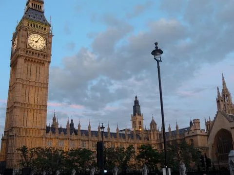 Evening Big Ben with clouds at sunset Stock Photos