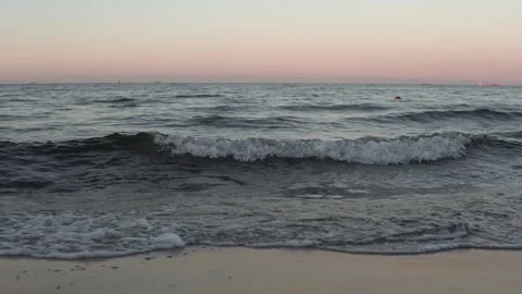 Evening Bliss: Gentle Waves and Glowing Horizons Stock Footage 293684510