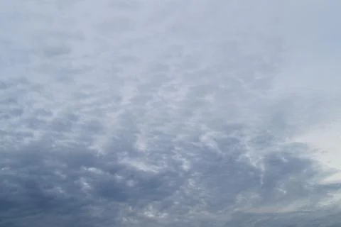 Evening blue sky with clouds. End of the day. The concept of calm and pacific Stock Photos