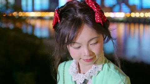 The evening breeze blows the beautiful face of the single girl Stock Footage 317093619