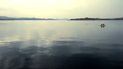 Evening On The Calm Lake With Distant Boat Stock Footage 82964107