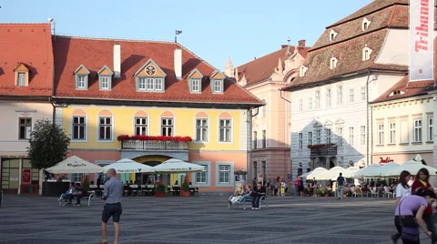 Evening in central square, people walking by restaurants in old European city Stock Footage 40568258