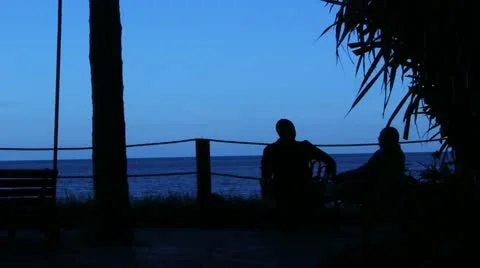 An Evening Chat Overlooking the Indian Ocean  (HD) Stock Footage 12609574