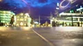 Evening city life, many people walking on square near illuminated shopping mall 4k or 4k+ Resolution