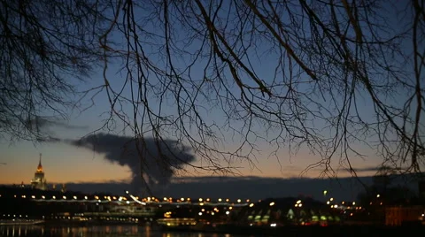 Evening city, tree branches on sky background Stock Footage 47877431
