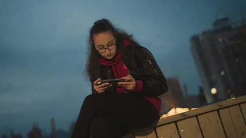 Evening Cityscape Behind Creator, Skyscraper View Complements Editing Session Stock Footage 329538212