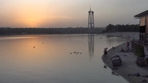 Evening cityscape the quiet water of the river in the light of the setting sun Stock Footage 138570982