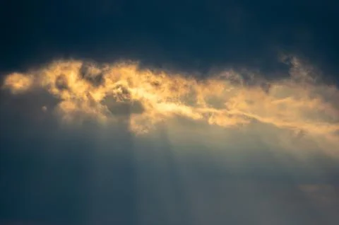 Evening clouds and sun rays Stock Photos