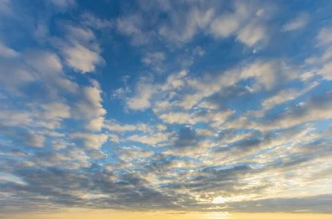 Evening clouds in the blue sky Stock Photos