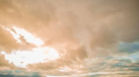 Evening clouds in the blue sky Stock Photos