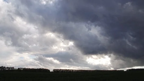 Evening clouds crawl through dark sky, accelerated time-lapse, getting darker Stock Footage 128802600