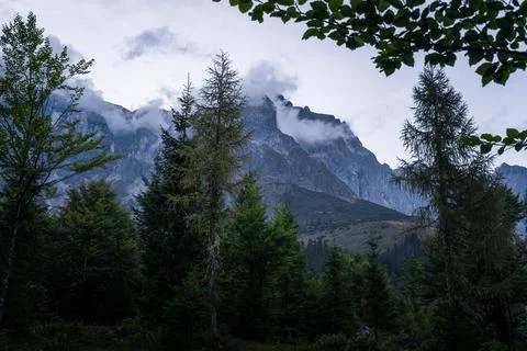 Evening clouds over Austrian Alps mountain landscape Stock Photos
