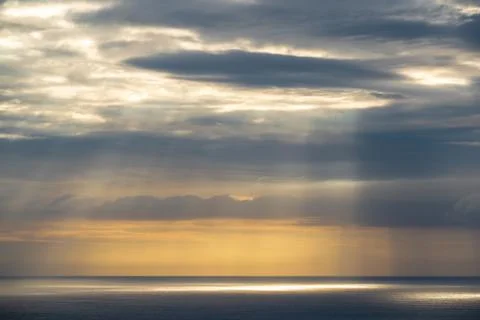 Evening clouds over sea Stock Photos