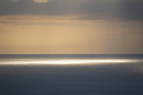 Evening clouds over sea Stock Photos