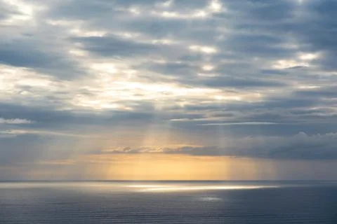 Evening clouds over sea Stock Photos