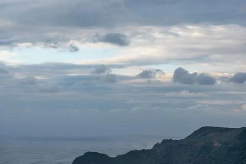 Evening clouds over sea Stock Photos