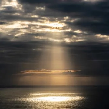 Evening clouds over sea Stock Photos