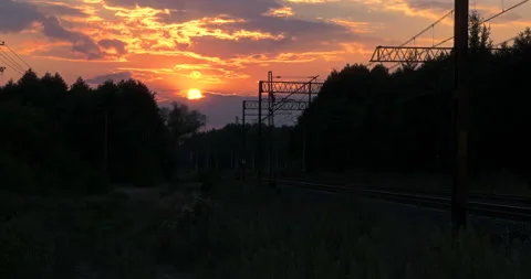 Evening Clouds Sunset over a Railroad Stock Footage 141145834