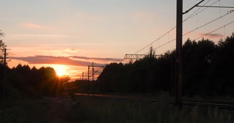 Evening Clouds Sunset over a Railroad Timelapse Stock Footage 141160366