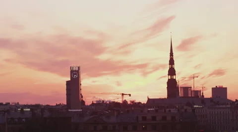 Evening clouds time lapse over a city skyline Stock Footage 42339677