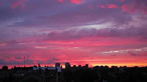 Evening clouds time lapse over a city skyline Stock Footage 64851420