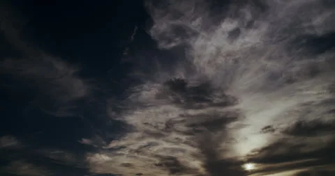 Evening cloudscape with atmospheric interplay between fragmenting clouds. Stock Footage 345090847