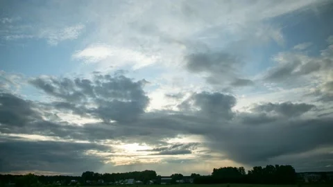 Evening cloudscape over village. Видео 144011027