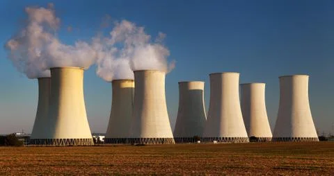 Evening colored sunset view of Nuclear power plant Stock Photos