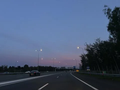 Evening commute on modern multi lane highway near Zuidas business district Stock Photos