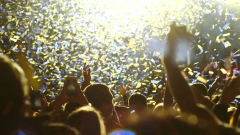 Evening concert. Crowd. White light. Confetti Stock Footage