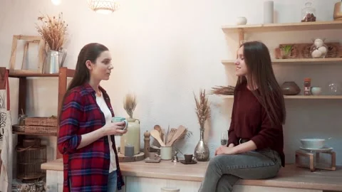 Evening conversation between two friends in the kitchen Stock Footage 176338234