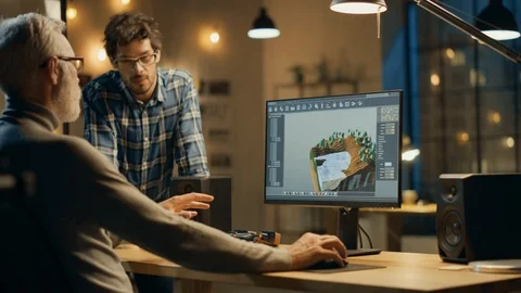 In the Evening Creative Middle Aged Video Game Developer Works on a Desktop PC Video stock 111318997