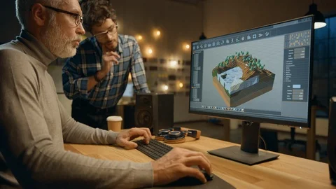 In the Evening Creative Middle Aged Video Game Developer Works on a Desktop PC Stock Footage 111319503