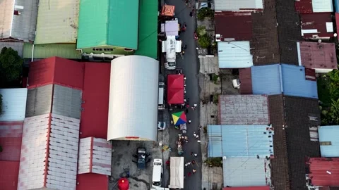 Evening crowds explore Kampung Valdor pasar malam stalls Stock Footage 332144838