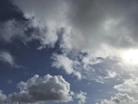 Evening Cumulus Clouds in the Sky Above a Natural Landscape Stock Photos