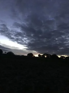 Evening dark clouds Stock Photos